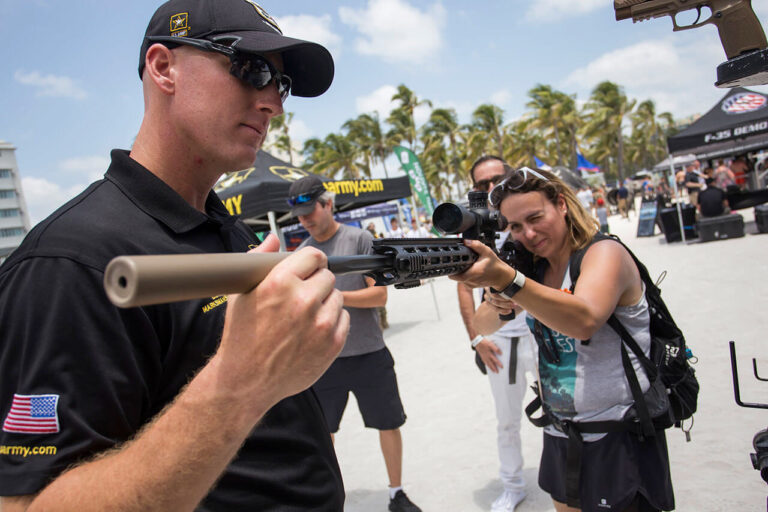 6_Women-Pointing-Gun - Mickey Markoff the Executive Producer of the Air and Sea Show